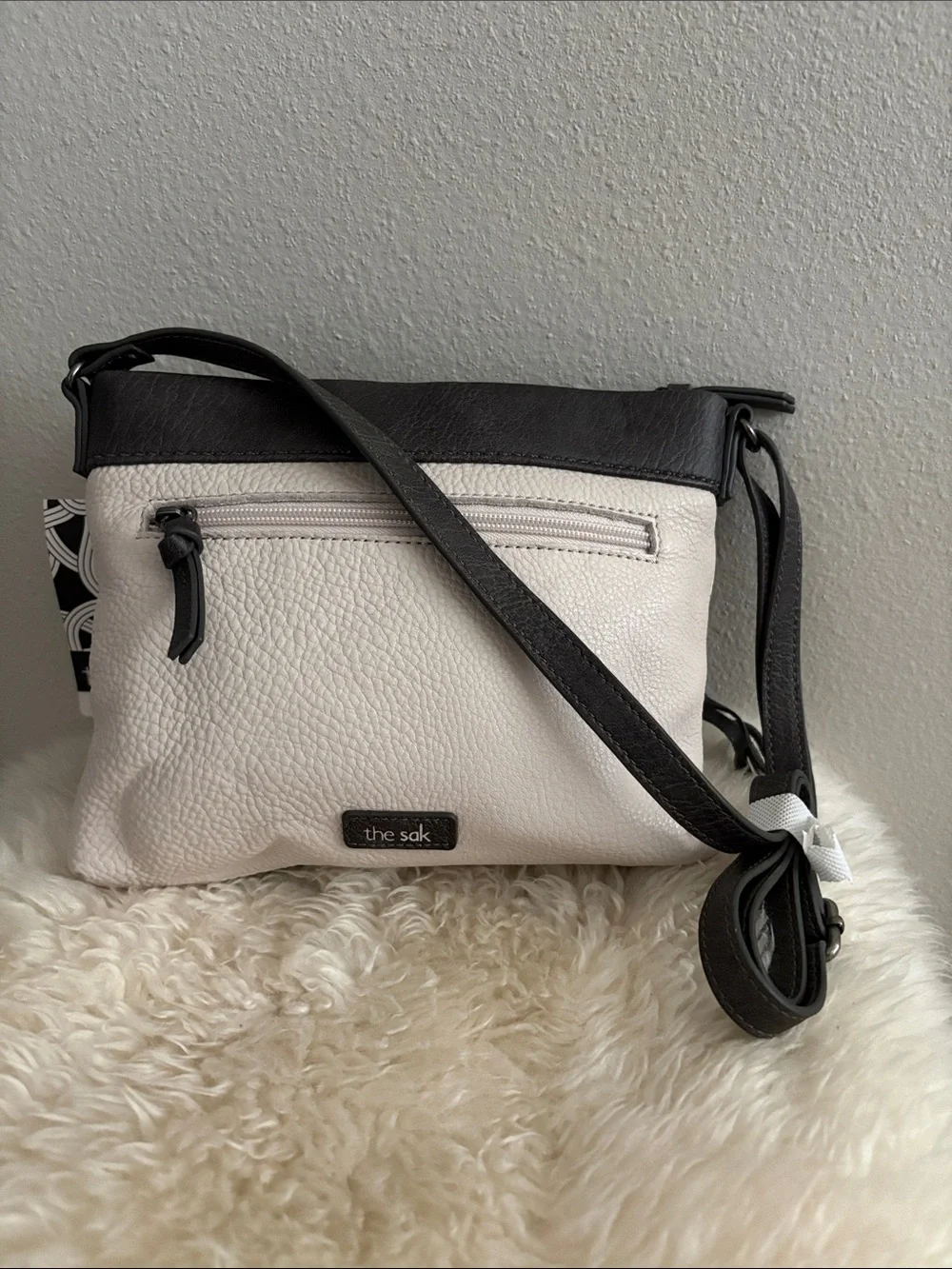 The Sak Leather Messenger Bag in Black and Cream Woven Front
